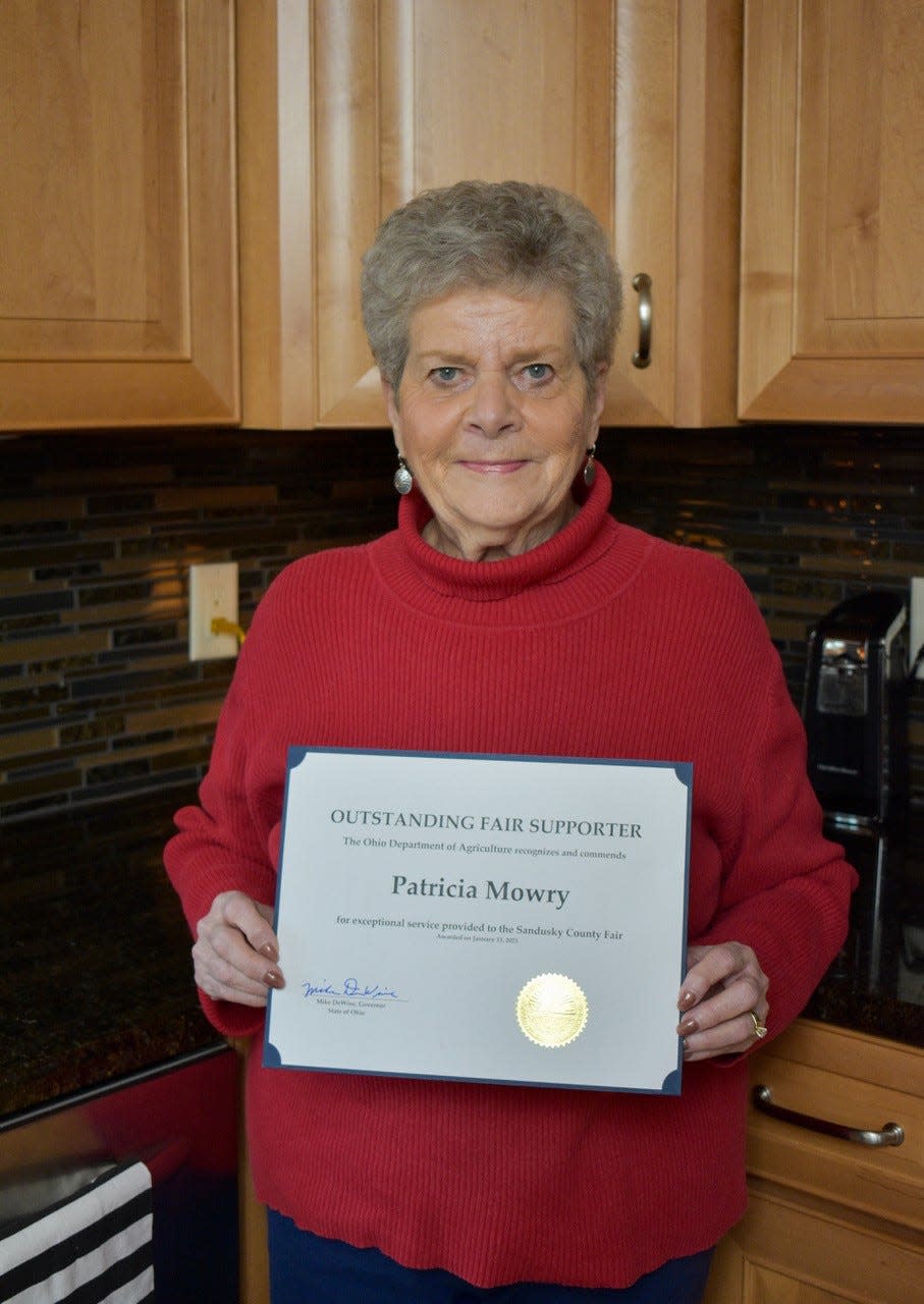 Pat Mowry holds the Outstanding Fair Supporter certificate she received from Gov. Mike DeWine. Mowry’s commitment to the fair earned her the nickname, “Mother of the Fair.”