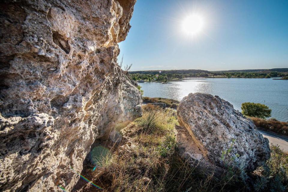 A stony outcropping of the sponge-like rock that makes up the Ogallala Aquifer is exposed in the hills high above Scott State Fishing Lake in Scott County, Kansas.