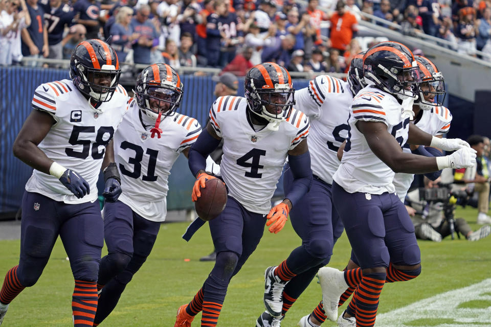 Chicago Bears safety Eddie Jackson (4) celebrates with teammates after intercepting a pass in the end zone against the Houston Texans during the first half of an NFL football game Sunday, Sept. 25, 2022, in Chicago. (AP Photo/Nam Y. Huh)