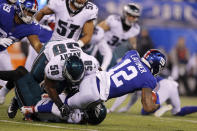 New York Giants wide receiver Cody Latimer (12) is stopped by Philadelphia Eagles defensive end Genard Avery (58) in the first half of an NFL football game, Sunday, Dec. 29, 2019, in East Rutherford, N.J. (AP Photo/Adam Hunger)