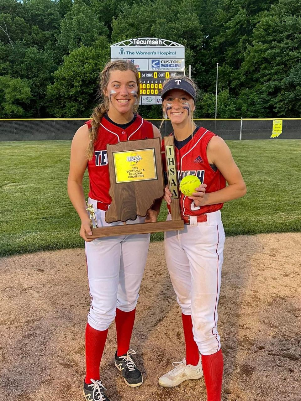 Brianna (left) and Katelyn Marx (right) seen here with the regional championship trophy. The sisters have been instrumental to Tecumseh’s success.