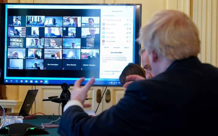 Boris Johnson adopted the measures at a meeting held remotely - ANDREW PARSONS  