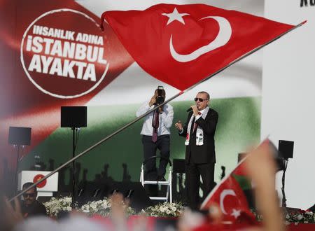 Turkish President Tayyip Erdogan delivers a speech during a protest against the recent killings of Palestinian protesters on the Gaza-Israel border and the U.S. embassy move to Jerusalem, in Istanbul, Turkey May 18, 2018. REUTERS/Osman Orsal