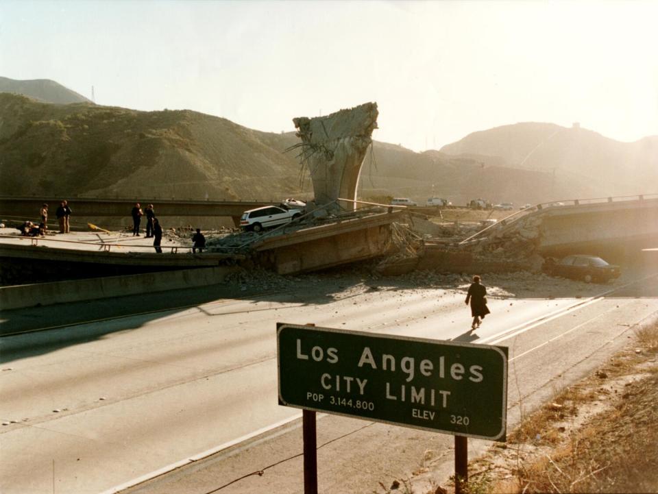 City of Los Angeles sign in the foreground of the Interstate 5 southbound lanes where the Interstate 14 road fell.