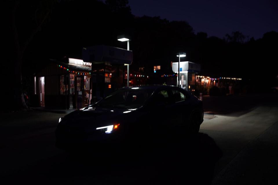 a car parked in a parking lot at night