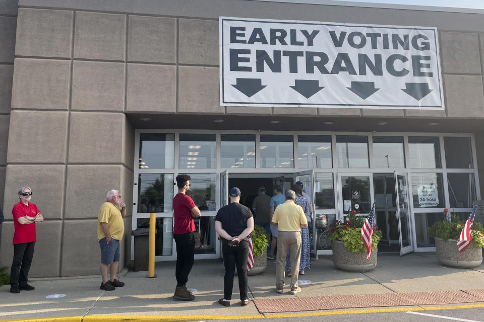 FILE - Ohio residents line up to vote early in-person on Issue 1 in front of the Franklin County Board of Elections in Columbus, Ohio on Thursday, Aug. 3, 2023. Ohioans are voting on whether to make it harder to amend the state's constitution – a decision that could impact another upcoming November vote on abortion rights in the state. (AP Photo/Samantha Hendrickson, File)