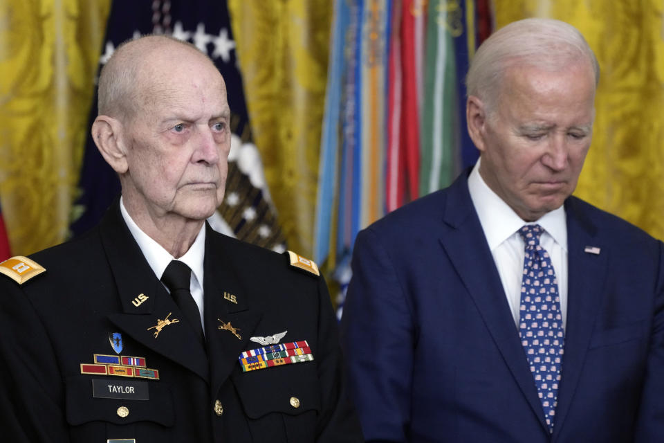 President Joe Biden listens to the citation being read before he awards the Medal of Honor to Capt. Larry Taylor, an Army pilot from the Vietnam War who risked his life to rescue a reconnaissance team that was about to be overrun by the enemy, during a ceremony Tuesday, Sept. 5, 2023, in the East Room of the White House in Washington. (AP Photo/Jacquelyn Martin)