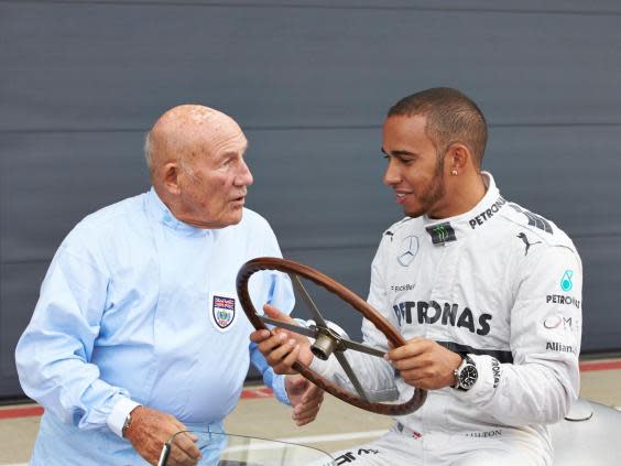 Sir Stirling and Lewis Hamilton share a conversation (Getty)