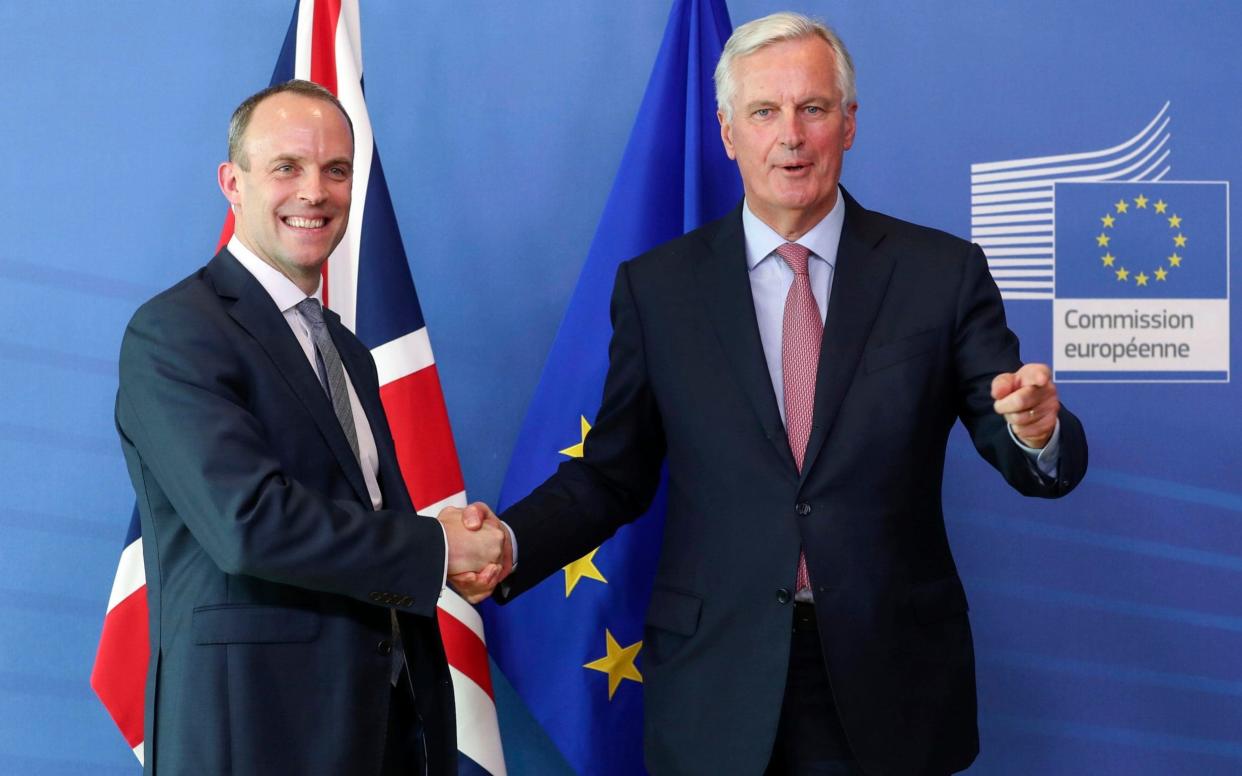 Dominic Raab, left, is welcomed by EU's chief Brexit negotiator Michel Barnier  - EPA pool