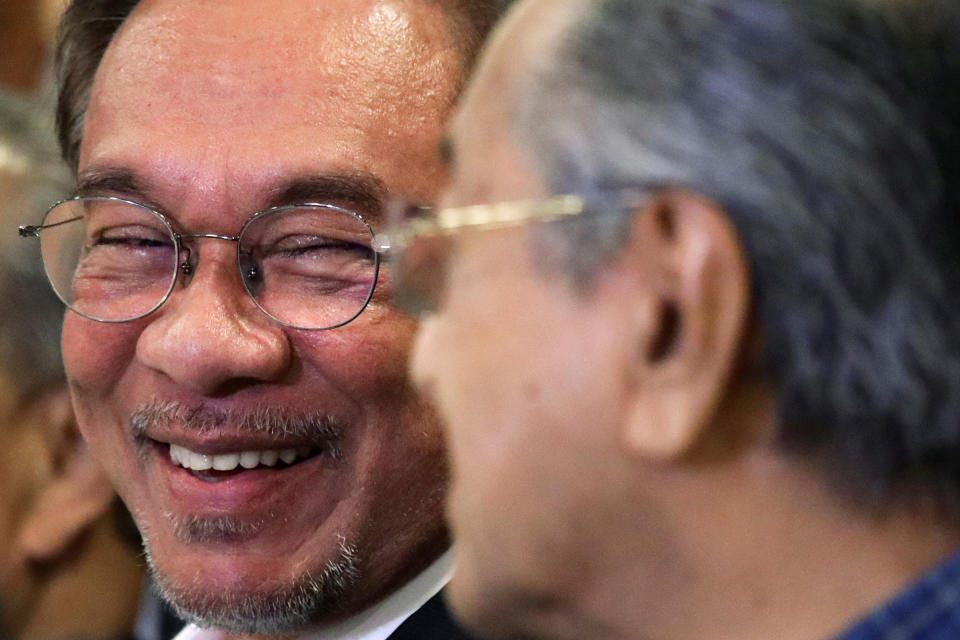 Malaysian politician Anwar Ibrahim looks at former Prime Minister Mahathir Mohamad during a news conference in Putrajaya, Malaysia, Nov. 23, 2019.<span class="copyright">Lim Huey Teng—Reuters</span>
