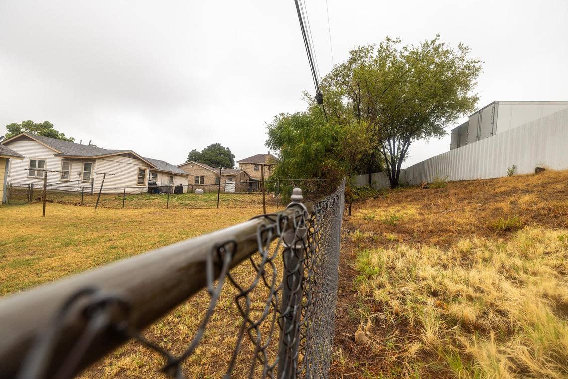 Multiple semi-trailers are parked adjacent to the backyard of Echo Heights resident Letitia Wilbourn. Wilbourn claims the expansion of industrial development in her neighborhood has caused health problems leading to sickness and death among her community.