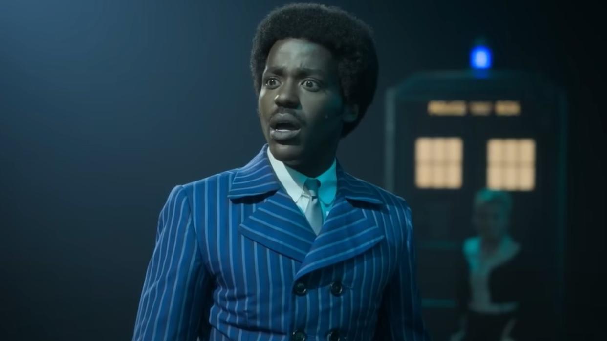  Ncuti Gatwa as The Doctor in Disney+'s Doctor Who, wearing retro clothes. 