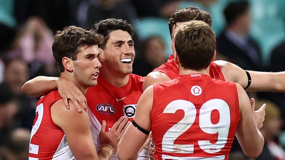 Sydney Swans players celebrate during their historic thumping of West Coast on Saturday night. Pic: Getty