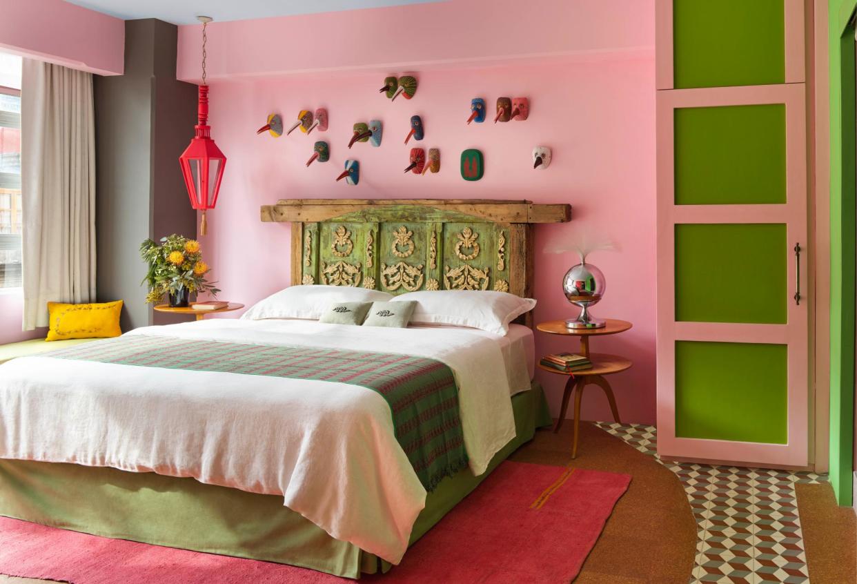 <span>Acid-green notes: the main bedroom.</span><span>Photograph: Annie Schlechter</span>