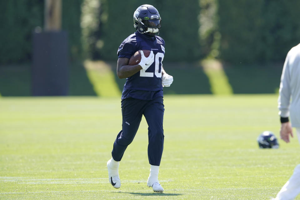 Seattle Seahawks running back Rashaad Penny carries the ball during NFL football practice Thursday, July 29, 2021, in Renton, Wash. (AP Photo/Ted S. Warren)