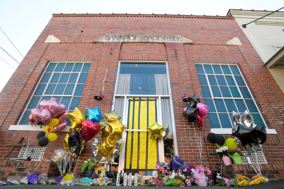 A makeshift memorial has shown up at the scene of the scene of the fatal mass shoting in Dadeville, Ala., seen on Wednesday April 19, 2023. 