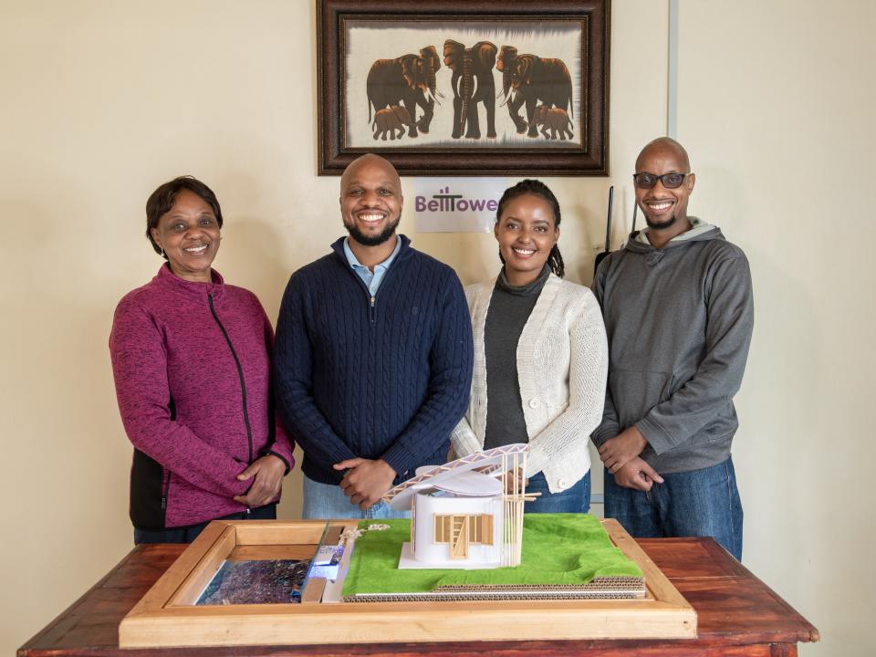 Kenya’s BellTower design firm with a model of their winning Open Source Communities project.