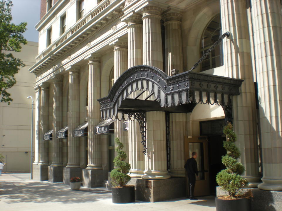 This undated photo provided by the Tulsa Regional Chamber shows the two-story columns at the entrance to the Mayo Hotel in Tulsa, Okla. It's one of a number of Tulsa buildings dating to the 1920s notable for their architecture and history. The Mayo, listed on the National Register of Historic Places, hosted many famous guests including President John F. Kennedy, Bob Hope, Babe Ruth and Charlie Chaplin. The hotel fell on hard times in the late 20th century and was abandoned for 20 years before a renovation restored it to a luxury hotel. (AP Photo/Tulsa Regional Chamber, Don Sibley)