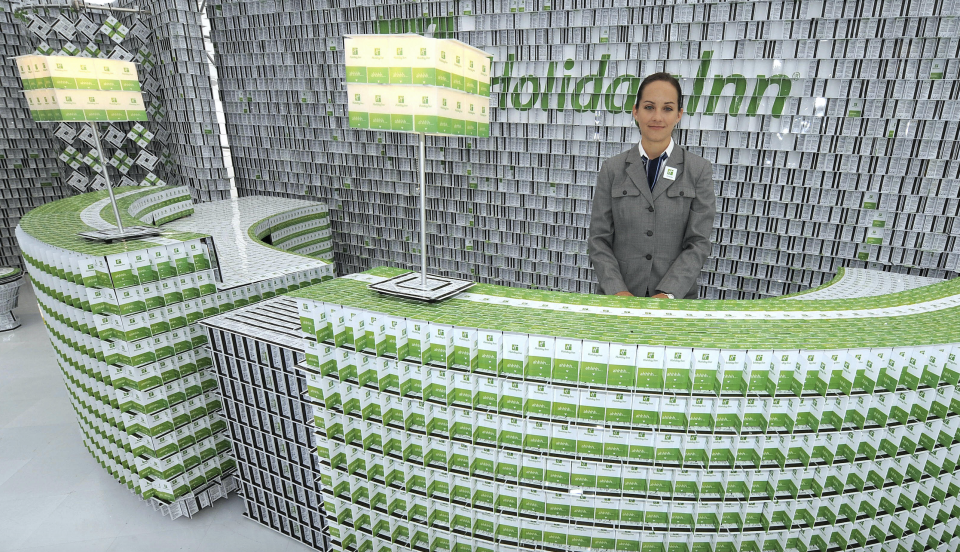 A Holiday Inn employee waits behind a front desk made of key cards as the first-ever key card hotel is unveiled September 17, 2009 in New York. (Photo: TIMOTHY A. CLARY/AFP/Getty Images) 