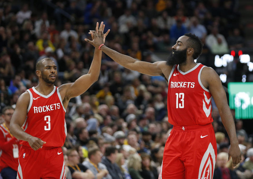 Chris Paul likes to high-five the Harden family. (AP)