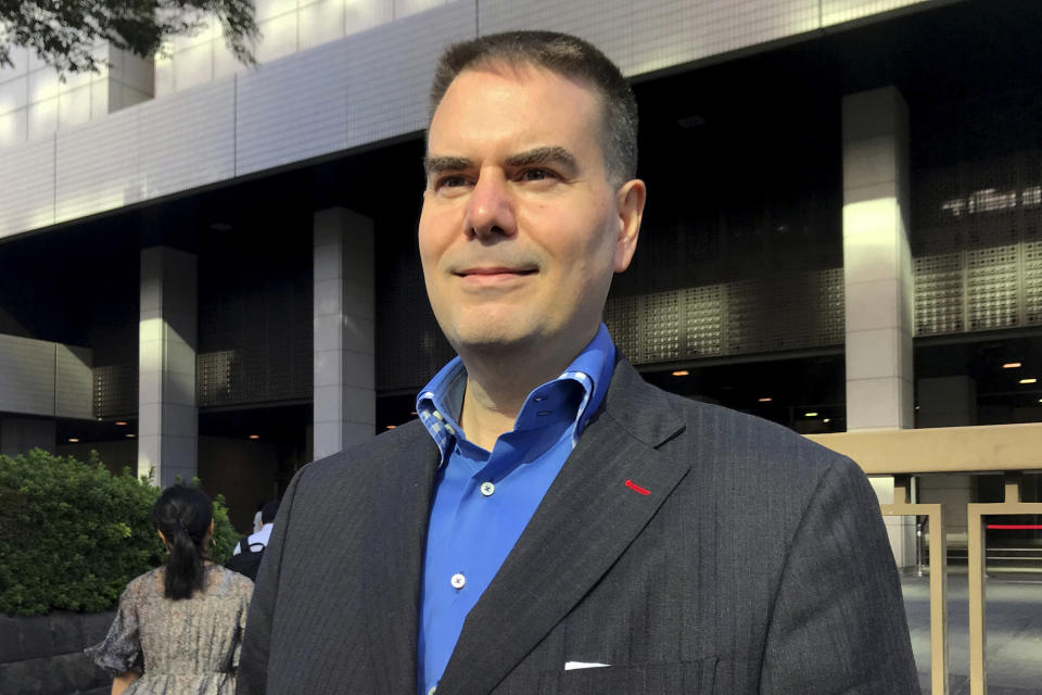 FILE - In this Oct. 9, 2019, file photo, former brokerage manager Canadian Glen Wood arrives at the Tokyo District Court before a hearing of the case that he was forced from his job for taking paternity leave in Tokyo. A Japanese court has rejected the demand by Wood to get his job back after he took paternity leave at Mitsubishi UFJ Morgan Stanley. (AP Photo/Yuri Kageyama, File)