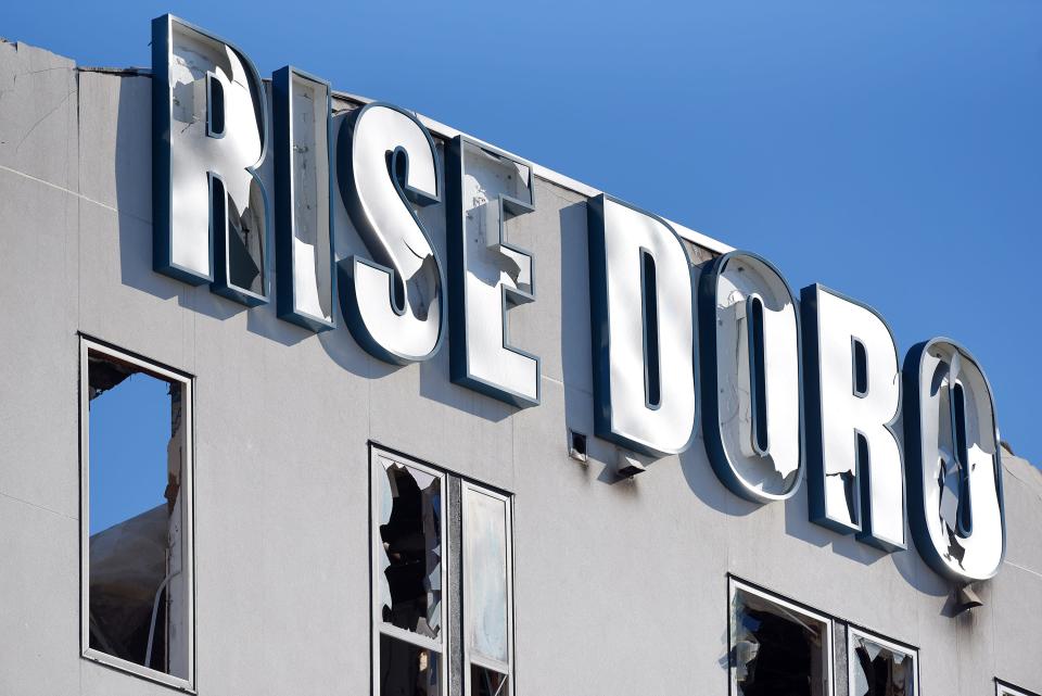 The signage on the south facade of the RISE Doro apartment complex shows the exent of damage caused by Sunday night's fire. Jacksonville firefighters continued to knock down hot spots Monday through Wednesday in the burned-out building on A. Philip Randolph Boulevard.