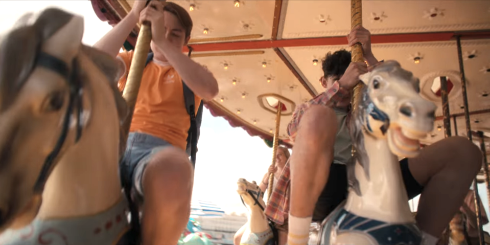 Nick and Charlie on a merry-go-round