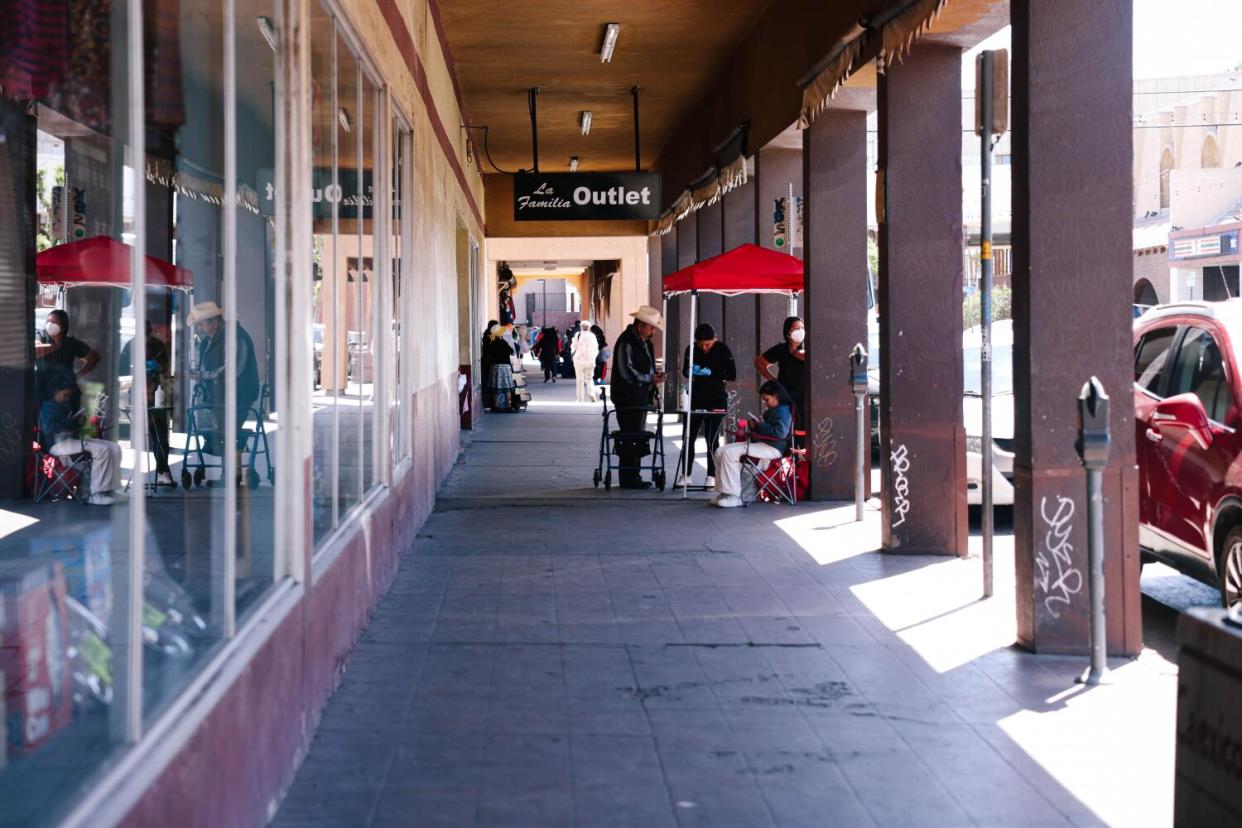 People visit a shopping arcade in Calexico, California