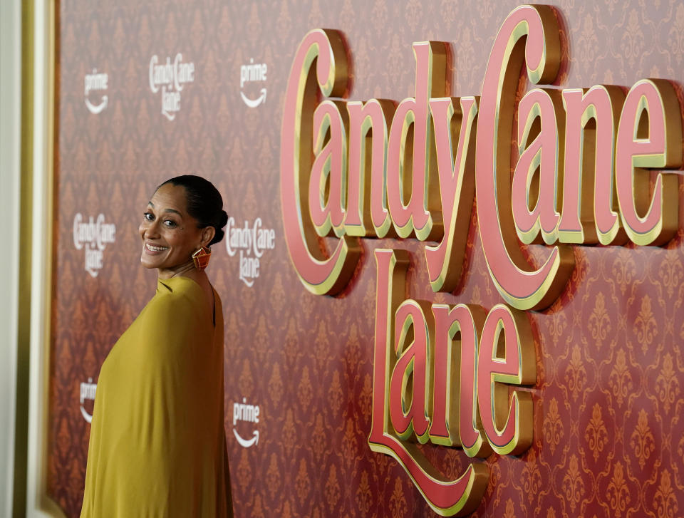 Tracee Ellis Ross, a cast member in "Candy Cane Lane," turns back for photographers at the premiere of the film at the Regency Village Theatre, Tuesday, Nov. 28, 2023, in Los Angeles. (AP Photo/Chris Pizzello)