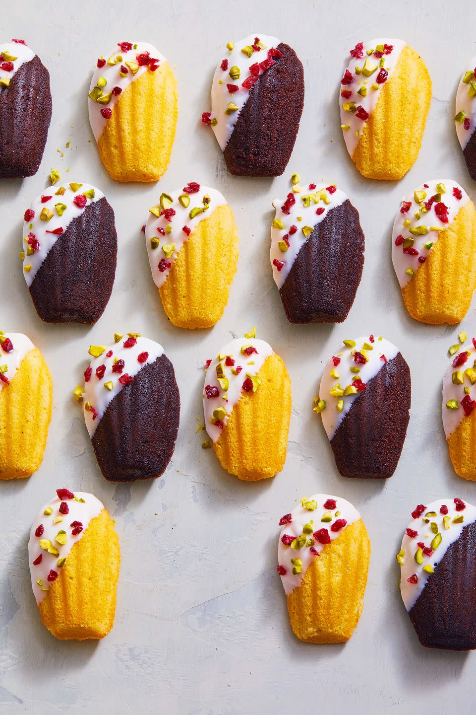 <p>Shh... no one has to know the madeleines are store-bought. Dip 'em in melted chocolate and sprinkle with chopped cranberries and pistachios so they look (and taste!) homemade.</p><p>Get the <a href="https://www.goodhousekeeping.com/food-recipes/dessert/a38026593/white-chocolate-dipped-madeleines-recipe/" rel="nofollow noopener" target="_blank" data-ylk="slk:White Chocolate-Dipped Madeleines recipe;elm:context_link;itc:0;sec:content-canvas" class="link "><strong>White Chocolate-Dipped Madeleines recipe</strong></a>.</p>
