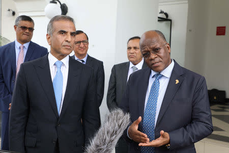 Tanzania's President John Magufuli (R) flanked by Bharti Airtel's chairman Sunil Mittal address the media at State House in Dar es Salaam, Tanzania January 11, 2019. Presidential Press Unit/Handout via REUTERS