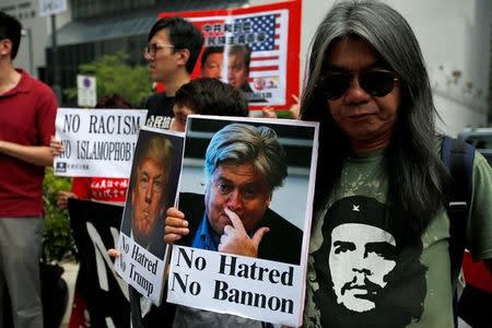 Protesters against Trump's former chief strategist Steve Bannon and U.S. President Donald Trump demonstrate outside a hotel, where Bannon will speak at the CLSA investor conference in Hong Kong, China September 12, 2017. REUTERS/Bobby Yip