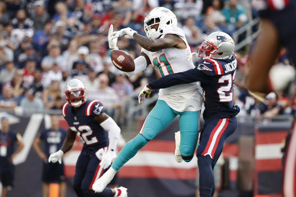 New England Patriots defensive back J.C. Jackson, right, breaks up a pass to Miami Dolphins wide receiver DeVante Parker (11) during the first half of an NFL football game, Sunday, Sept. 12, 2021, in Foxborough, Mass. (AP Photo/Winslow Townson)
