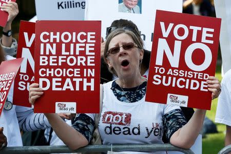 Pro "assisted dying" campaigners protest outside the Houses of Parliament in central London, Britain September 11, 2015. REUTERS/Stefan Wermuth