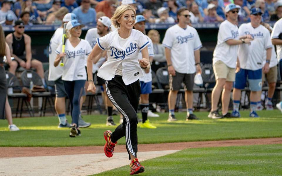 “Saturday Night Live” star and Big Slick host Heidi Gardner runs to first base during the Big Slick celebrity softball game at Kauffman Stadium on Friday.