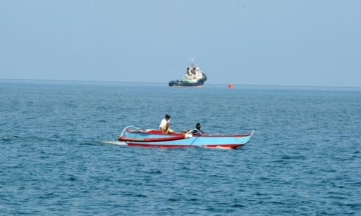 Local residents are seen aboard their motorised wooden boats, near the market of Masinloc, Zambales province, north of Manila, on May 10. China has denied it is increasing combat readiness in response to a territorial row with the Philippines over a disputed shoal in the South China Sea