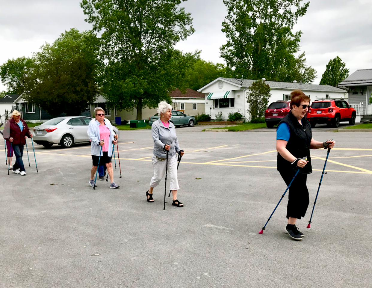 <span class="caption">Members of the Oasis Senior Supportive Living Program pole walking in their community.</span>