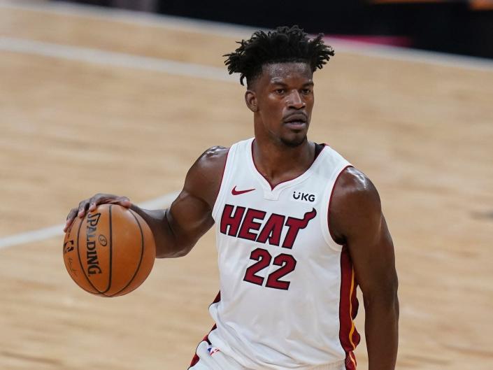 Jimmy Butler dribbles the ball during a game in 2021.