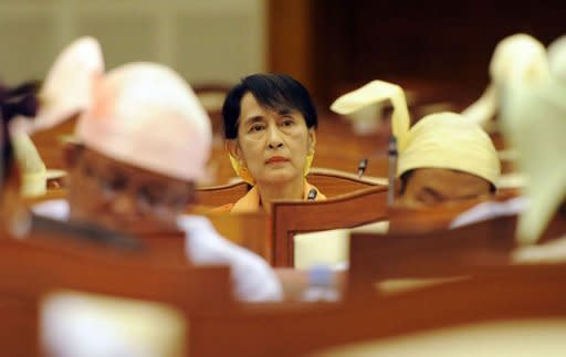 Myanmar opposition leader Aung San Suu Kyi attends the lower house of parliament in Naypyidaw, on July 11. US Secretary of State Hillary Clinton held landmark talks on Friday with Myanmar President Thein Sein as he pleaded for the global community to end decades of isolation for his nation