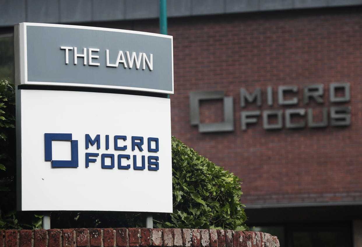 Signs stand outside the offices of Micro Focus after they and Hewlett Packard Enterprise Co announced that Hewlett Packard Enterprise Co will spin off and merge its non-core software assets with Britain's Micro Focus International in a deal worth $8.8 billion, in Newbury, Britain, September 8, 2016. REUTERS/Eddie Keogh 