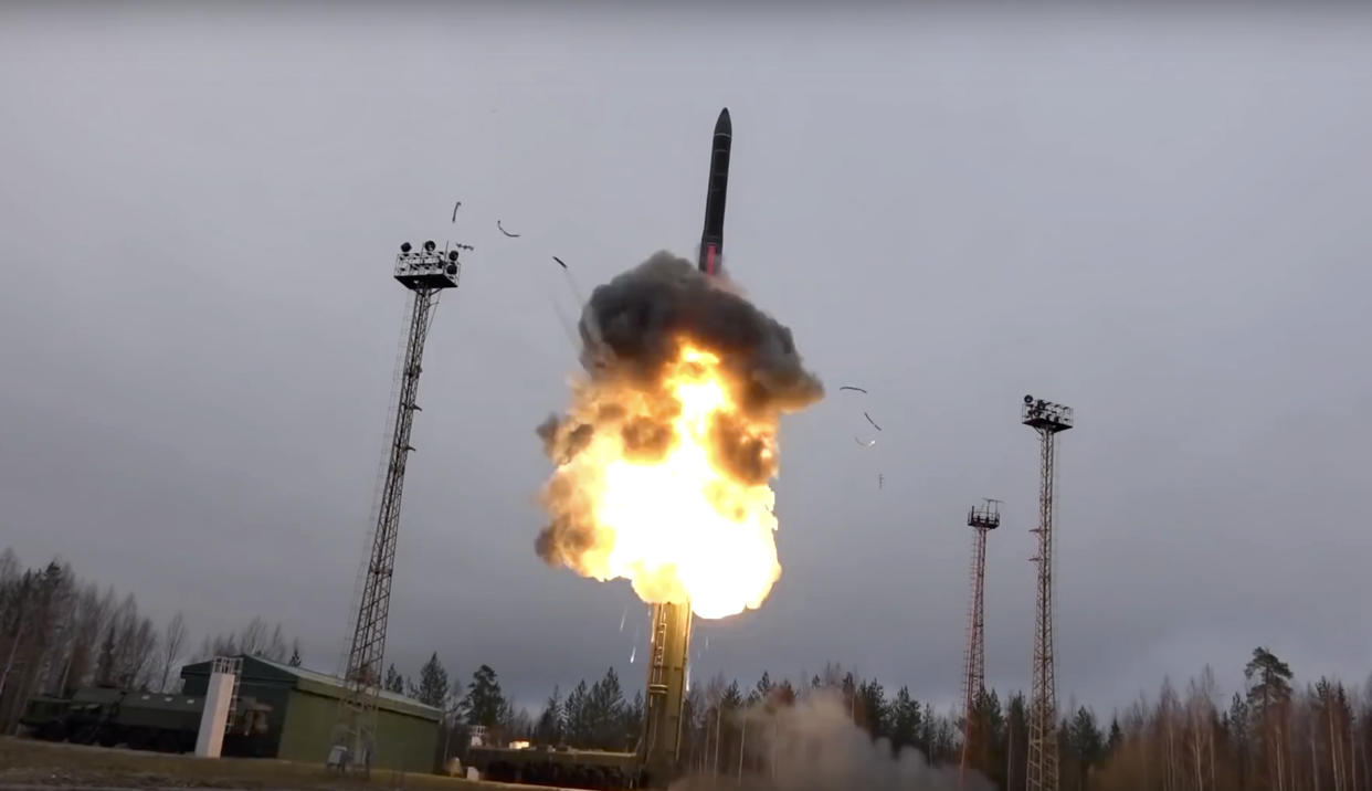 In this photo taken from undated footage distributed by the Russian Defense Ministry Press Service, an intercontinental ballistic missile lifts off from a truck-mounted launcher somewhere in Russia.