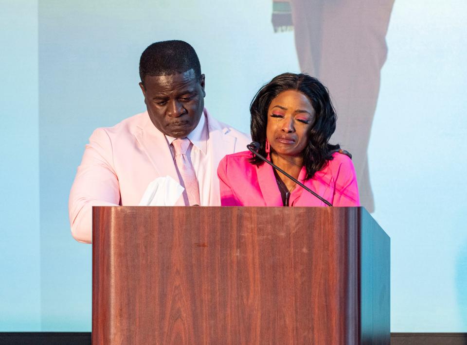 Carlos Robinson, left, father of Sade Robinson, and Sheena Scarbrough, mother of Sade Robinson, speak about their memories of their daughter at a public memorial service Friday at the Baird Center in Milwaukee.