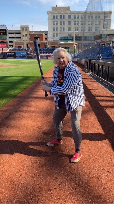 Trish Ostroski, 76, of Cuyahoga Falls participates in the Akron RubberDuck’s Party in the Park till its Dark event to celebrate the total solar eclipse April 8, 2024 in Canal Park.