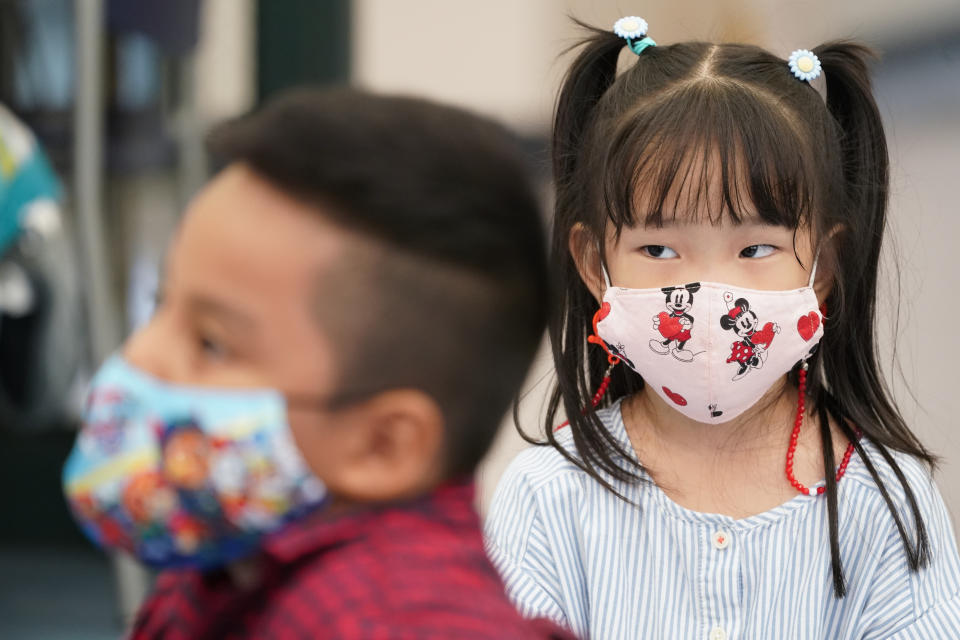 Pre-K students wear face masks to protect against the coronavirus during a class at the Dr. Charles Smith Early Childhood Center, Thursday, Sept. 16, 2021, in Palisades Park, N.J. Gov. Phil Murphy toured the school before announcing plans to plans to provide universal pre-K for all families in New Jersey. (AP Photo/Mary Altaffer)