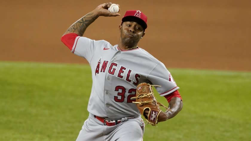 Los Angeles Angels relief pitcher Raisel Iglesias throws to the Texas Rangers during a baseball game in Arlington, Texas, Wednesday, April 28, 2021. (AP Photo/Tony Gutierrez)