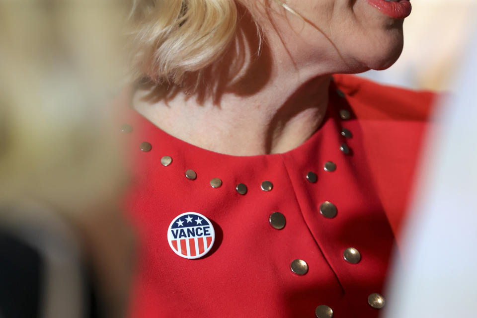 A supporter wears a button during an election night watch party in support of Republican Senate candidate JD Vance, Tuesday, May 3, 2022, in Cincinnati. (AP Photo/Aaron Doster)