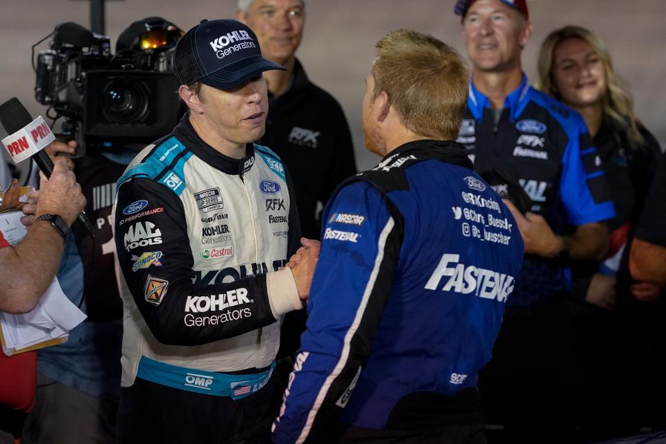 Keselowski (left) congratulates Chris Buescher after Buescher won the Bristol Night Race for RFK Racing last fall.