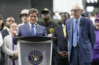 Milwwaukee Brewers owner Mark Attanasio and Wisconsin Gov. Tony Evers answer questions after Evers signed Assembly Bill 438 and Assembly Bill 439 at American Family Field Tuesday, Dec. 5, 2023, in Milwaukee. The bills use public funds to help the Milwaukee Brewers repair their stadium over the next three decades. (AP Photo/Morry Gash)