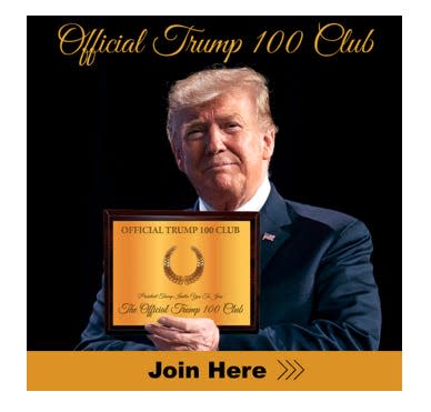 Donald Trump holding plaque