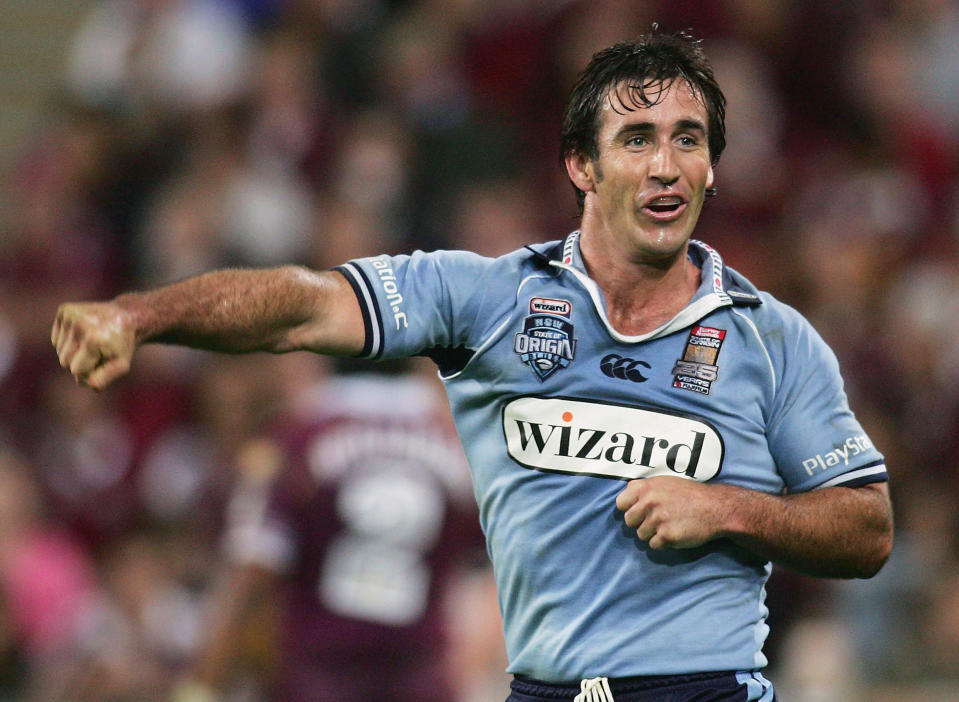 Andrew Johns fist-pumps and celebrates a try during game three of the State of Origin.